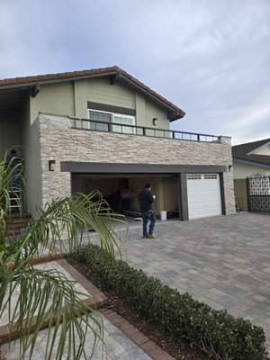 Converse Howe Cir. Garden Grove - Due to storm drain issues that caused damage to the garage header beam, we replaced the header beam and renovated the front elevation with a waterproof decking system on the second-floor balcony and veneer stone finishes and New Interlocking Paver driveway Installed. Converse Howe Cir. Garden Grove - Due to storm drain issues that caused damage to the garage header beam, we replaced the header beam and renovated the front elevation with a waterproof decking system on the second-floor balcony and veneer stone finishes and New Interlocking Paver driveway Installed.