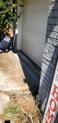 Channel Drain Installation/ Exterior drainage - This is what a typical channel drain installation would look like. This particular client's house is on a SLAB foundation, a cost effective option is to address and redirect the drainage on the outside of the house. In this you will see the channel drain being placed Infront of the garage because they had water intrusion in the garage area. Channel Drain Installation/ Exterior drainage - This is what a typical channel drain installation would look like. This particular client's house is on a SLAB foundation, a cost effective option is to address and redirect the drainage on the outside of the house. In this you will see the channel drain being placed Infront of the garage because they had water intrusion in the garage area.