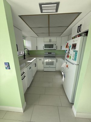 Kitchen Install - This kitchen was gutted from a flood. We completed the drywall, paint, cabinetry, and countertops. Kitchen Install - This kitchen was gutted from a flood. We completed the drywall, paint, cabinetry, and countertops.