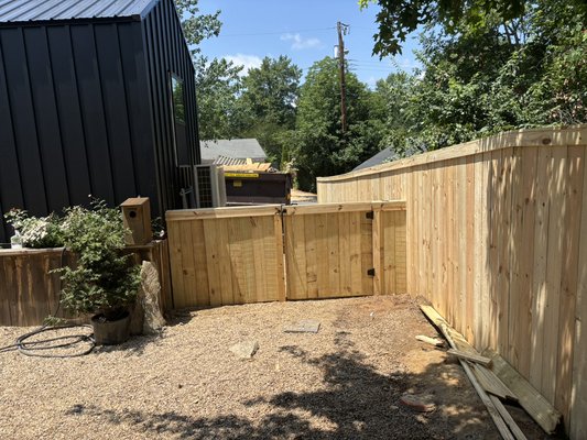 Privacy Fence Install - The new fence spans 320 feet and stands 6 feet tall, providing a secure and private boundary. It features three gates for convenient access. Privacy Fence Install - The new fence spans 320 feet and stands 6 feet tall, providing a secure and private boundary. It features three gates for convenient access.