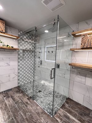 Shower Door Installation - The epitome of luxury with Maxi Glass's exquisite three-panel frameless shower enclosure, where elegance met functionality. Crafted from high-quality 3/8" tempered glass, each enclosure is custom-sized to seamlessly integrate with your bathroom's unique dimensions. The design features two sleek fixed panels and one smoothly sliding panel, offering both spaciousness and ease of access. Installed by our professional Maxi Glass team, you can trust in the precision and expertise that defines our work. With our frameless shower enclosures, our client now enjoys a bathing experience that blends sophistication, durability, and convenience, all brought by the shower enclosure experts at Maxi Glass." Shower Door Installation - The epitome of luxury with Maxi Glass's exquisite three-panel frameless shower enclosure, where elegance met functionality. Crafted from high-quality 3/8" tempered glass, each enclosure is custom-sized to seamlessly integrate with your bathroom's unique dimensions. The design features two sleek fixed panels and one smoothly sliding panel, offering both spaciousness and ease of access. Installed by our professional Maxi Glass team, you can trust in the precision and expertise that defines our work. With our frameless shower enclosures, our client now enjoys a bathing experience that blends sophistication, durability, and convenience, all brought by the shower enclosure experts at Maxi Glass."