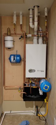 Tankless Boiler - We saved this owner from having a flood that would have destroyed the units below him. By installing a wall-mounted boiler to replace the overgrown water tank that heated his unit and domestic hot water, he now has more space and PEACE OF MIND!