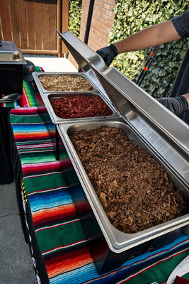 Taco Bar - Full-service taco bar setup featuring fresh, hand-pressed corn tortillas made right on site, premium grilled meats kept hot and ready, and a complete salsa bar with handcrafted salsas, fresh toppings, and grilled chiles/onions served in traditional molcajetes. Paired with delicious, ice-cold horchata to complete the authentic Mexican catering experience for any event! Taco Bar - Full-service taco bar setup featuring fresh, hand-pressed corn tortillas made right on site, premium grilled meats kept hot and ready, and a complete salsa bar with handcrafted salsas, fresh toppings, and grilled chiles/onions served in traditional molcajetes. Paired with delicious, ice-cold horchata to complete the authentic Mexican catering experience for any event!