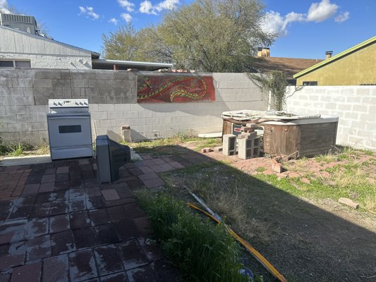 Junk haul and yard clean-up - Hot tub, stove, TV and yard debris all hauled away. Took care of the weeds, did a little tree pruning and cleaned up the yard. Happy customer!