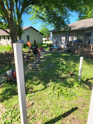 Backyard Transformation - Manitowoc Pro Lawn Care's extensive work in the backyard involved the removal of two 100-foot trees and multiple layers of landscape fabric built up from 50 years of landscaping work. In addition, we removed large boulders to prepare the area for grading and seeding. By removing the trees and fabric layers, we created a more open and inviting space that was easier to maintain. Our team ensured that the area was graded to prevent water from pooling and to promote healthy grass growth. Finally, we seeded the area to establish new growth and restore the backyard to its former beauty. Overall, our extensive work improved the safety, aesthetics, and value of the property.