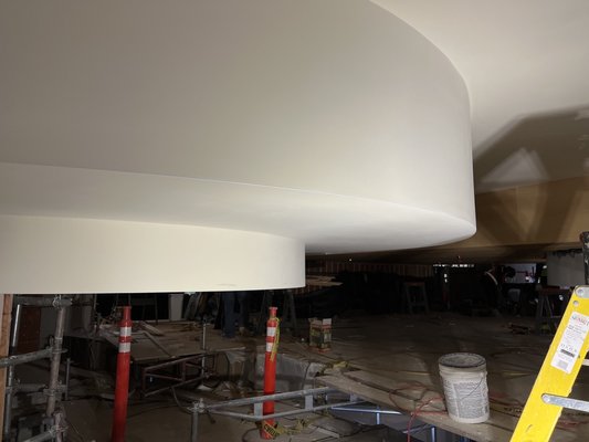 Smooth level 5 ceiling and radius soffits. - These ceiling were hung with 5/8” drywall, we taped and coated the seamed and soffits. After we coated we skimmed the ceiling, sanded and delivered them ready for paint.