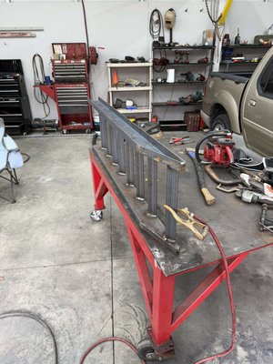 Trailer Ramps - Fabricated and welded a custom set of steel trailer ramps. Cut and assembled the frame, added support bracing, and completed all welds. Finished with grinding and protective coating.