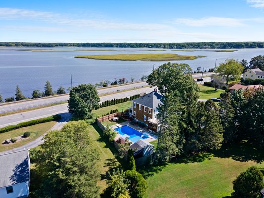 Stunning Corner-Lot Colonial Home, overlooking Hundred Acre Pond, in beautiful Barrington, RI - BEAUTIFUL BARRINGTON AWAITS!!
This corner-lot Colonial on nearly one half acre of land blends classic old world charm with modern updates and amenities. The year round water view of Hundred Acre Cove will add serenity to any day whether you're sipping coffee on the porch, enjoying family afternoons in the front yard or taking advantage of the nearby public access to boating and fishing. In the fenced backyard you'll find yourself immersed in your very own resort-style retreat.
The 10X20 back deck is set up for entertaining and overlooks an amazing Salt-Water In-Ground Swimming Pool that is accompanied by a custom built bar, a unique converted fire pit, grassy areas for pets and play, a spacious shed and a very fun cabana that could double as a "kids-cave" (once you see it, you'll understand - it's great)!
Inside the home you'll be blessed with Hardwood Floors, an 18X15 Living Room, 1st Floor Steam Shower and a Chef's Kitchen featuring Granite Counters, Stainless Steel Appliances & Gas Cooking. The front foyer is like a journey back in time with French Doors to the large Dining Room and a stunning staircase with a decorative oak bannister leading to the 2nd floor. Upstairs are 4 nicely sized bedrooms (one currently being used as a walk in closet) and one Full Bath.
On top of all that... the fully finished basement features a cozy Family Room, Den, Laundry Room and a Utility Room with plenty of storage space. This is the HOME you've been waiting for. Call The Donnie Bennett Team for your private tour! 401-383-4400. Stunning Corner-Lot Colonial Home, overlooking Hundred Acre Pond, in beautiful Barrington, RI - BEAUTIFUL BARRINGTON AWAITS!!
This corner-lot Colonial on nearly one half acre of land blends classic old world charm with modern updates and amenities. The year round water view of Hundred Acre Cove will add serenity to any day whether you're sipping coffee on the porch, enjoying family afternoons in the front yard or taking advantage of the nearby public access to boating and fishing. In the fenced backyard you'll find yourself immersed in your very own resort-style retreat.
The 10X20 back deck is set up for entertaining and overlooks an amazing Salt-Water In-Ground Swimming Pool that is accompanied by a custom built bar, a unique converted fire pit, grassy areas for pets and play, a spacious shed and a very fun cabana that could double as a "kids-cave" (once you see it, you'll understand - it's great)!
Inside the home you'll be blessed with Hardwood Floors, an 18X15 Living Room, 1st Floor Steam Shower and a Chef's Kitchen featuring Granite Counters, Stainless Steel Appliances & Gas Cooking. The front foyer is like a journey back in time with French Doors to the large Dining Room and a stunning staircase with a decorative oak bannister leading to the 2nd floor. Upstairs are 4 nicely sized bedrooms (one currently being used as a walk in closet) and one Full Bath.
On top of all that... the fully finished basement features a cozy Family Room, Den, Laundry Room and a Utility Room with plenty of storage space. This is the HOME you've been waiting for. Call The Donnie Bennett Team for your private tour! 401-383-4400.