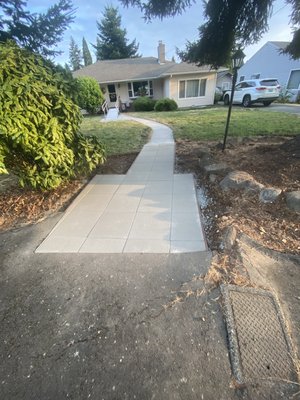 Paver patio - This home features two cleanly installed paver pads that enhance accessibility and curb appeal. The front entrance pad connects seamlessly to a wheelchair ramp, offering a safe, stable surface, while the driveway-side pad links the sidewalk to the street for smooth entry from vehicles or foot traffic. Paver patio - This home features two cleanly installed paver pads that enhance accessibility and curb appeal. The front entrance pad connects seamlessly to a wheelchair ramp, offering a safe, stable surface, while the driveway-side pad links the sidewalk to the street for smooth entry from vehicles or foot traffic.