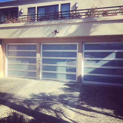 Glass Garage Door Installs - Laguna Beach home that needed the garage doors done to give the house a more, contemporary look. Glass Garage Door Installs - Laguna Beach home that needed the garage doors done to give the house a more, contemporary look.