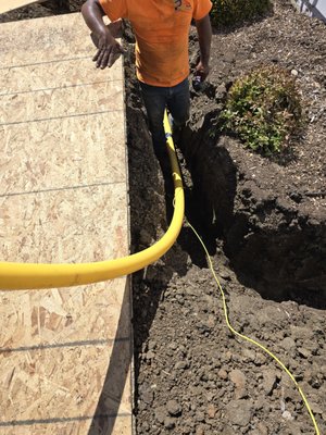 Partial Trenchless Gas Line Replacement - Our install crew is cutting concrete as needed, to dig down to install new gas pipe starting from back of the pool house to two barbecue islands and one fire pit. This must be hand dug which makes the job time consuming. Abandoning the old compromised gas piping and installing new two inch and three-quarter inch poly pipe underground at the cemented and planter areas. Partial Trenchless Gas Line Replacement - Our install crew is cutting concrete as needed, to dig down to install new gas pipe starting from back of the pool house to two barbecue islands and one fire pit. This must be hand dug which makes the job time consuming. Abandoning the old compromised gas piping and installing new two inch and three-quarter inch poly pipe underground at the cemented and planter areas.