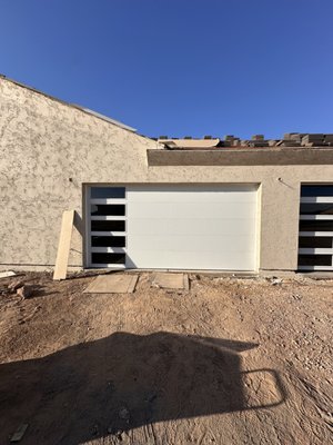 Garage Door Installation - Installed a 16x8 steel-back garage door with sleek left-side glass panels. This design offers both strength and style, adding insulation and natural light to the garage. It’s the perfect balance of durability and curb appeal, enhancing both security and aesthetics.