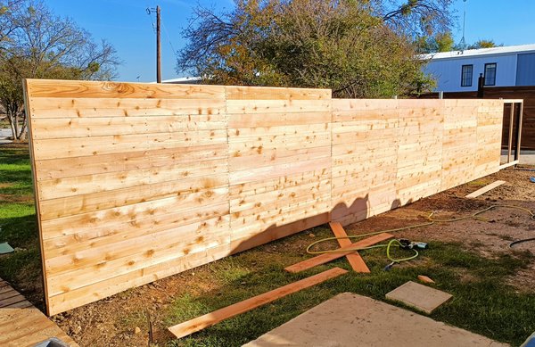 Custom built privacy fence - This was a fence we built for a long time friend of the boss. The customer was very pleased with how it turned out. We always enjoy the finished product and seeing the customers reaction.