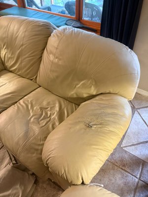 Leather Armrest Repair – Sofa - This leather sofa armrest was heavily worn, cracked, and dry from years of regular use.

The damaged leather surface was repaired, stabilized, and refinished to restore its appearance. Color was blended to match the surrounding leather, and a protective finish was applied to improve durability and help prevent future cracking.