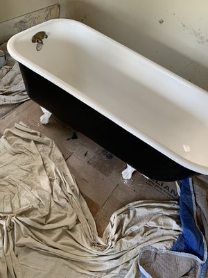 Clawfoot tub restoration - Clawfoot tub restoration started by filling in all the chips along the rim of the tub. After sanding smooth, and then cleaned, the tub was then reglazed and a flat black finish was applied to the exterior