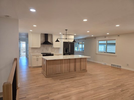 Arvada Kitchen Remodel - This kitchen was a bit outdated, and the owners wanted to update the kitchen and help change the feeling of the entire house. We ended up removing two walls to create an open kitchen, installing new handrails, new lighting, and refinishing the hardwood floors. Arvada Kitchen Remodel - This kitchen was a bit outdated, and the owners wanted to update the kitchen and help change the feeling of the entire house. We ended up removing two walls to create an open kitchen, installing new handrails, new lighting, and refinishing the hardwood floors.
