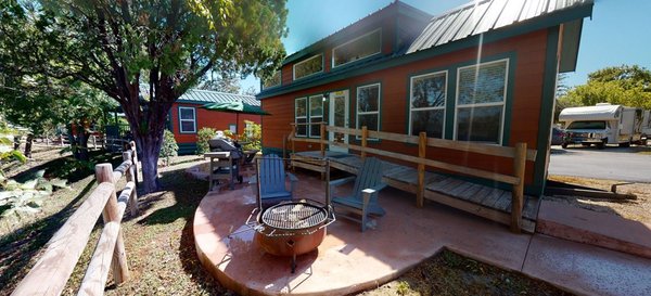 Ways To Stays - Cabins - This newly remodeled cabin has a private bedroom with queen. It can sleep up to 2 adults and has bunk beds for the kids. It features a KOA patio with a swing, table, fire-ring and gas grill. Ways To Stays - Cabins - This newly remodeled cabin has a private bedroom with queen. It can sleep up to 2 adults and has bunk beds for the kids. It features a KOA patio with a swing, table, fire-ring and gas grill.