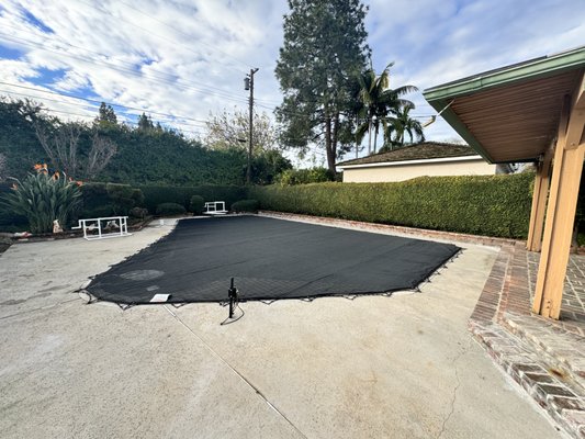 All-Safe Pool Leaf Cover - A leaf pool cover is one of the most practical solutions for keeping your swimming pool clean, clear, and easier to maintain throughout the year. If you have trees, shrubs, or landscaping anywhere near your pool, you know how quickly leaves, seed pods, pine needles, and other debris can accumulate in the water. Skimming leaves every day, cleaning out filters, and vacuuming sludge from the bottom of the pool is exhausting and time consuming. An All‑Safe Leaf Pool Cover offers an effective way to stop the mess before it reaches the water, saving you time, effort, and money on maintenance.

All‑Safe Leaf Pool Covers are made from a strong, tightly woven polyethylene mesh designed specifically to block leaves and large debris while allowing rainwater to pass through. This is an important distinction from heavy, solid tarp‑style covers that tend to collect water and create unpleasant, stagnant puddles. Because rainwater drains naturally through the mesh, there is no standing water to pump off or clean, and your pool area stays looking neat and tidy throughout the season.

Each cover is custom cut to fit the exact shape of your pool. Whether your pool is a standard rectangle or a freeform design, All‑Safe measures it carefully to ensure a snug, professional fit. The perimeter of every leaf cover is reinforced with durable webbing and brass grommets, then anchored to your deck with a system of stainless steel hooks or bungee cords. This anchoring method holds the cover securely in place, even during windy weather, while still allowing for quick and easy removal when you want to access your pool.

One of the biggest benefits of an All‑Safe Leaf Pool Cover is how much it reduces the workload for pool owners. With a cover in place, leaves and other debris never reach the water. This means less organic material breaking down in your pool, fewer stains, and reduced chemical demand. Your filter and pump will not need to strain against constant clogs, which can extend the life of your pool equipment and help you avoid costly repairs. The overall result is a cleaner pool and more time to enjoy it instead of maintaining it.

Putting on the leaf cover is straightforward. Homeowners typically unroll the mesh across the pool, attach the edges to the anchors around the deck, and secure the cords in place. The process usually takes between five and fifteen minutes for an average pool. Removing the cover is just as simple. The cords are detached, the mesh is rolled up, and the cover is stowed until it is needed again. Because the mesh is lightweight, one person can usually handle the job without special equipment or assistance.

Leaf covers also add value when paired with other pool safety solutions. While a leaf cover alone is not intended to serve as a safety barrier for children or pets, it is often installed over an All‑Safe Safety Net. The safety net provides ASTM‑rated protection, and the leaf cover on top keeps debris out of the pool. This two‑layer combination delivers a cleaner pool and reliable safety in one system.

Durability is another reason homeowners choose All‑Safe. Our leaf covers are designed for years of use and are made from materials that stand up to constant sun exposure, rain, and pool chemicals. The mesh fabric is UV resistant and will not easily fade or weaken. With proper care and seasonal maintenance, your All‑Safe Leaf Pool Cover can provide long‑term service, making it an excellent investment in your pool and backyard.

All‑Safe has been helping families protect and maintain their pools for over 30 years. We take pride in offering products that are thoughtfully designed, built to last, and installed with precision. When you choose an All‑Safe Leaf Pool Cover, you are working with a team that understands pools and knows how to provide solutions that make your life easier. Each installation is customized to your pool and your needs, ensuring you receive a product that not only performs well but also looks great in your outdoor space.

If you are tired of fishing leaves out of your pool, clearing clogged filters, or fighting stains and algae caused by decaying debris, a leaf cover can completely change the way you maintain your pool. Instead of spending hours cleaning, you can simply roll the cover into place, relax, and enjoy a pool that stays cleaner with minimal effort. When it is time to swim, the cover comes off quickly and easily, leaving you with clear water and less mess to worry about.

All‑Safe Leaf Pool Covers are the smart, simple way to keep leaves out and your pool maintenance routine stress‑free. Contact us today to learn more about how a custom leaf cover can protect your pool, extend the life of your equipment, and save you valuable time every season.