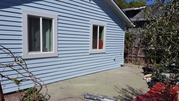 Exterior House Painting - The exterior of this home needed a refresh, old paint, worn siding, and a look that didn't match the rest of the updated property. We painted the full exterior, giving it a clean, modern light blue finish that transformed the curb appeal from top to bottom.