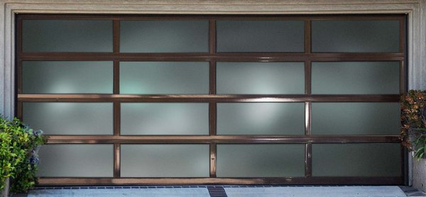 New Glass Garage Door Installtion - This door was installed on a new construction house in Malibu. The Designer asked for a modern door with woodlike touches , after the measurements we took the time to show all the options both to designer and customer. They decided to go with modern aluminum glass door with Bronze touch. we added jackshaft opener for smooth operation. New Glass Garage Door Installtion - This door was installed on a new construction house in Malibu. The Designer asked for a modern door with woodlike touches , after the measurements we took the time to show all the options both to designer and customer. They decided to go with modern aluminum glass door with Bronze touch. we added jackshaft opener for smooth operation.