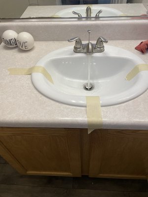 Sink and faucet replacement - Replaced the old, rusted sink and faucet with new ones. The old sink and faucet were removed, new ceramic sinks were installed and sealed, faucets and drains were replaced, and white silicone was applied for a clean finish.