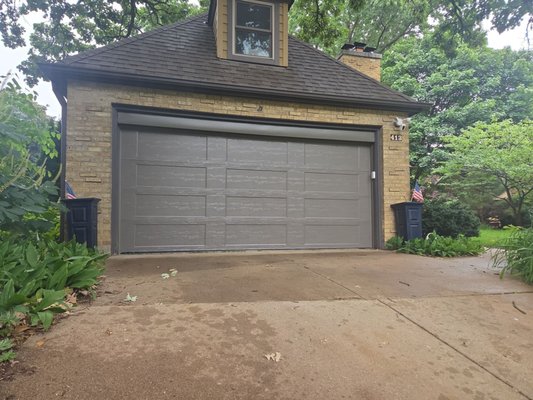 Install in Elgin - What a transformation in Elgin!
This home originally had a one-piece wooden garage door that had definitely lived a long life and was ready for retirement. We removed the original door, reframed the opening to accommodate a modern sectional garage door, installed the new door and opener system, and finished the opening with aluminum trim for a clean, polished look.
The homeowner wanted to update the garage while keeping the new door complementary to the existing style of the home. The Clopay Bridgeport Extended Panel design in Bronze was the perfect fit—providing a fresh, updated look without taking away from the home’s original character.
The finished transformation looks amazing, and we love how naturally the new door fits the home! Install in Elgin - What a transformation in Elgin!
This home originally had a one-piece wooden garage door that had definitely lived a long life and was ready for retirement. We removed the original door, reframed the opening to accommodate a modern sectional garage door, installed the new door and opener system, and finished the opening with aluminum trim for a clean, polished look.
The homeowner wanted to update the garage while keeping the new door complementary to the existing style of the home. The Clopay Bridgeport Extended Panel design in Bronze was the perfect fit—providing a fresh, updated look without taking away from the home’s original character.
The finished transformation looks amazing, and we love how naturally the new door fits the home!