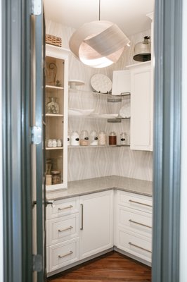 The Queen's Pantry - This is a pantry you will leave the door open on purpose! Beautiful space with wallpaper, gorgeous hardware on the doors, acrylic shelves are fun and unique to store pantry goods.
White custom cabinets built and installed. The Queen's Pantry - This is a pantry you will leave the door open on purpose! Beautiful space with wallpaper, gorgeous hardware on the doors, acrylic shelves are fun and unique to store pantry goods.
White custom cabinets built and installed.