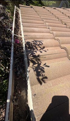 Gutter Cleaning & Repair - Gutter cleaning and repair service. Removed built-up debris, thoroughly cleaned the gutters, and reinforced loose sections with metal brackets and screws for a stronger, more secure fit. Before and after photos show the completed work.