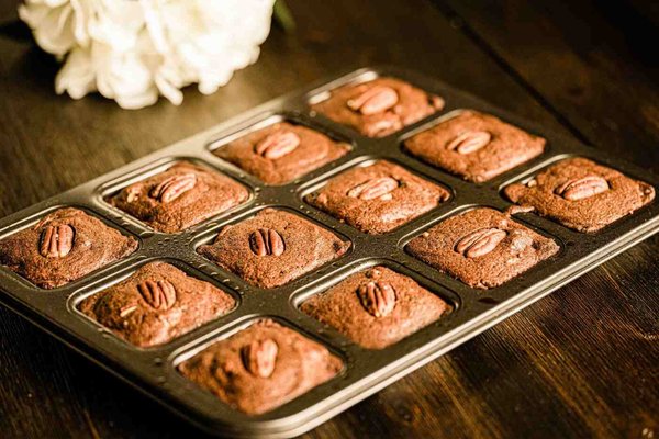 Brownies and Fudge - Brownies: Indulge in our rich, decadent brownies, a perfect blend of fudgy interior and a slightly crisp exterior. Each bite is packed with deep chocolate flavor, making it a classic treat that’s hard to resist. Perfect on its own or warmed up with a scoop of ice cream!
Peanut Butter Fudge Cups: Satisfy your sweet tooth with our irresistible Peanut Butter Fudge Cups. These delightful treats feature three layers: a crunchy chocolate base, a creamy peanut butter filling, and a smooth, decadent truffle layer on top. Each bite is a heavenly combination of textures and flavors, making them a must-try for peanut butter lovers! Brownies and Fudge - Brownies: Indulge in our rich, decadent brownies, a perfect blend of fudgy interior and a slightly crisp exterior. Each bite is packed with deep chocolate flavor, making it a classic treat that’s hard to resist. Perfect on its own or warmed up with a scoop of ice cream!
Peanut Butter Fudge Cups: Satisfy your sweet tooth with our irresistible Peanut Butter Fudge Cups. These delightful treats feature three layers: a crunchy chocolate base, a creamy peanut butter filling, and a smooth, decadent truffle layer on top. Each bite is a heavenly combination of textures and flavors, making them a must-try for peanut butter lovers!
