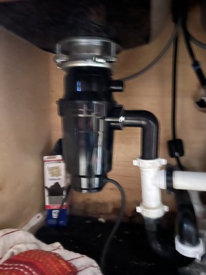 New Garbage Disposal Install - Customer requested new garbage disposal installation to replace 20 year old disposal. While installing the new disposal it was found that the last plumber had placed a large amount of silicone on the regular sink and had tack welded the sink strainer to prevent leakage when she washed dishes. The welded sink drain strainer was cut out and the new strainer installed along with a new drain pipe. New Garbage Disposal Install - Customer requested new garbage disposal installation to replace 20 year old disposal. While installing the new disposal it was found that the last plumber had placed a large amount of silicone on the regular sink and had tack welded the sink strainer to prevent leakage when she washed dishes. The welded sink drain strainer was cut out and the new strainer installed along with a new drain pipe.