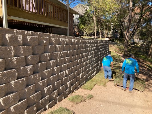 Wall Build 2022! - This customer had foundation problems and needed a wall to retain the soil around their house. We designed and built this beautiful Diamond Pro wall with reinforcement, drainage and sod. Wall Build 2022! - This customer had foundation problems and needed a wall to retain the soil around their house. We designed and built this beautiful Diamond Pro wall with reinforcement, drainage and sod.