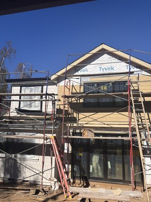 Exterior paint - Exterior painting of a new project from scratch, preparation, application of primer and two coats of paint Exterior paint - Exterior painting of a new project from scratch, preparation, application of primer and two coats of paint