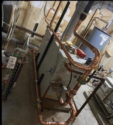 Hot Water/Heating Boiler repipe - We were dispatched to a commercial multi family housing establishment relating no heat or hot water. Upon arrival we found someone had shut off the boilers and removed all the copper piping. Before and after pictures are seen below.