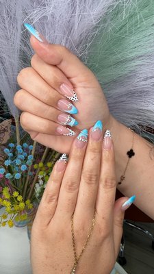 Gel Extension full set with inspo nail art - Custom almond-shaped full set featuring a soft nude base with turquoise French tips, paired with delicate black & white polka dot accents and fine line detailing. This design blends a clean, classy look with a fun pop of color—perfect for spring/summer or a chic vacation vibe
Hand-painted details for a unique, one-of-a-kind finish. Structured for durability while keeping a lightweight, natural feel.
Services: Full Set + Gel Polish + Hand-Painted Nail Art
Perfect for: Vacation nails, spring/summer sets, or anyone wanting a fresh, playful French twist Gel Extension full set with inspo nail art - Custom almond-shaped full set featuring a soft nude base with turquoise French tips, paired with delicate black & white polka dot accents and fine line detailing. This design blends a clean, classy look with a fun pop of color—perfect for spring/summer or a chic vacation vibe
Hand-painted details for a unique, one-of-a-kind finish. Structured for durability while keeping a lightweight, natural feel.
Services: Full Set + Gel Polish + Hand-Painted Nail Art
Perfect for: Vacation nails, spring/summer sets, or anyone wanting a fresh, playful French twist
