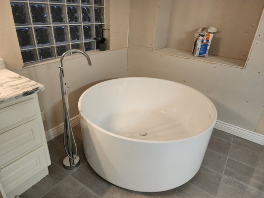Bathroom remodel - Bathroom remodel. Removed old garden tub and Roman rub faucet. 
Installed stand alone tub and faucet. 
Installed new shower valve with body sprayer. Updated bathroom complete.