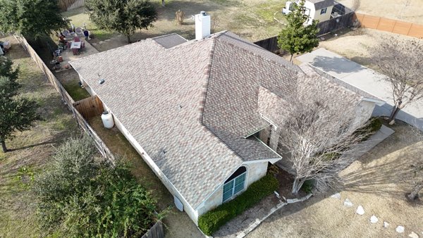 GAF HDZ Golden Harvest, Salado, TX - We recently completed a full re-deck and installation of the GAF HDZ Golden Harvest Roof system for our customer in Salado, TX . Our services included complete re-roof and installation of decking. We installed synthetic underlayment and Stormgaurd ice & water shield for superior protection against moisture. The new GAF HDZ Golden Harvest shingles provide enhanced durability and wind resistance. We also integrated color-matched accessories for a seamless and polished appearance, re-roofed both sheds to match the main dwelling, replaced hail damaged chimney siding and fascia, and installed 6" gutters.