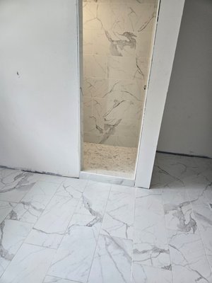 Shower addition in 80 year old home - Shower pan installation, waterproof walls, marble mosaic on shower floor, 12x24 porcelain tile on shower walls. Very satisfied customer! About one week start to finish for this project. Shower addition in 80 year old home - Shower pan installation, waterproof walls, marble mosaic on shower floor, 12x24 porcelain tile on shower walls. Very satisfied customer! About one week start to finish for this project.