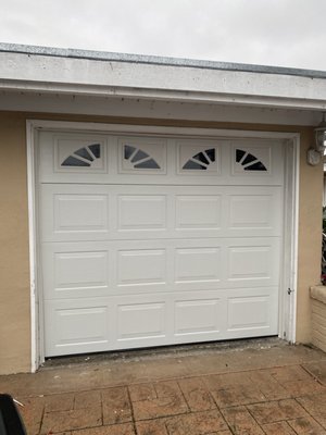 Single Car Garage Upgrade - This is a single car garage transformed from wood tilt up to low-head room steel sectional door Single Car Garage Upgrade - This is a single car garage transformed from wood tilt up to low-head room steel sectional door