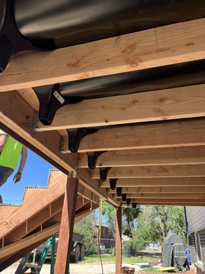 Full deck demo and rebuild with rain escape and trex plus metal handrail - We constructed a brand new deck entirely from scratch. Its dimensions are 8 feet by 17 feet, including a newly installed set of stairs and a sleek black handrail. Full deck demo and rebuild with rain escape and trex plus metal handrail - We constructed a brand new deck entirely from scratch. Its dimensions are 8 feet by 17 feet, including a newly installed set of stairs and a sleek black handrail.