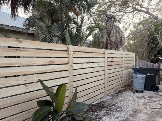 8’H horizontal shadowbox, PTP, Pre-Stained pickets. Built in Sarasota - This 8’H fence was built for complete privacy between two neighbors. The previous fence had blown down during Milton. We built this fence with 6’ wide panels, rather than 8’ wide like the previous fence. The 6’ wide panels, make this stronger and more secure.
We further enhanced the fences strength by using 4” x 6” x 13’ posts to ensure this fence will have the best chance to stand up to any further hurricanes! 8’H horizontal shadowbox, PTP, Pre-Stained pickets. Built in Sarasota - This 8’H fence was built for complete privacy between two neighbors. The previous fence had blown down during Milton. We built this fence with 6’ wide panels, rather than 8’ wide like the previous fence. The 6’ wide panels, make this stronger and more secure.
We further enhanced the fences strength by using 4” x 6” x 13’ posts to ensure this fence will have the best chance to stand up to any further hurricanes!
