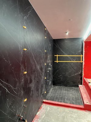 Luxurious Bathroom with Nero Marquina Porcelain, Los Angeles, CA - This stunning bathroom project features the sophisticated elegance of Nero Marquina porcelain for the shower walls and bathtub surround. The deep black tiles with striking white veining create a dramatic and luxurious atmosphere, perfect for a modern, high-end bathroom. The meticulous installation and premium materials ensure both durability and easy maintenance, making this space not only beautiful but also practical. Ideal for those who appreciate refined aesthetics and top-quality craftsmanship in their home. Luxurious Bathroom with Nero Marquina Porcelain, Los Angeles, CA - This stunning bathroom project features the sophisticated elegance of Nero Marquina porcelain for the shower walls and bathtub surround. The deep black tiles with striking white veining create a dramatic and luxurious atmosphere, perfect for a modern, high-end bathroom. The meticulous installation and premium materials ensure both durability and easy maintenance, making this space not only beautiful but also practical. Ideal for those who appreciate refined aesthetics and top-quality craftsmanship in their home.