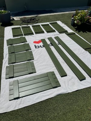 Exterior house painting with new shutters - For this project Buildda refreshed the full exterior of a single family home in the Los Angeles area. The original paint was tired so we helped the owners choose a new soft green color for the stucco with crisp white trim and deeper green shutters to match the landscaping. Our crew protected the artificial turf plants and stone walkway, removed and painted the shutters on site and fully primed and painted the walls, fascia and eaves. The result is a clean bright front yard and a home that now stands out on the street and feels new again.