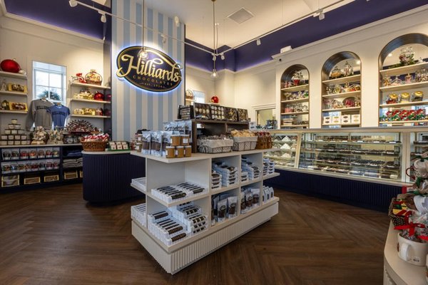 Hilliards Chocolate Fit Out - We had a great time transforming Hilliards Chocolate's new fit-out at 1 Chestnut Street, West Newton, MA 02465! This charming chocolate shop, established in 1924, features delightful candies, gifts, and a whimsical interior that's perfect for sweet-toothed locals.
Our crew handled the key painting and installation work: painting the walls and ceilings, adding the navy blue strip line (running trim border below the ceiling) for clean contrast, and installing blue-and-white striped wallpaper for that classic candy store vibe. All finished with durable, high-quality coats to withstand daily retail use. Hilliards Chocolate Fit Out - We had a great time transforming Hilliards Chocolate's new fit-out at 1 Chestnut Street, West Newton, MA 02465! This charming chocolate shop, established in 1924, features delightful candies, gifts, and a whimsical interior that's perfect for sweet-toothed locals.
Our crew handled the key painting and installation work: painting the walls and ceilings, adding the navy blue strip line (running trim border below the ceiling) for clean contrast, and installing blue-and-white striped wallpaper for that classic candy store vibe. All finished with durable, high-quality coats to withstand daily retail use.