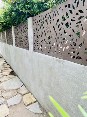 Tropical Tranquility: Stucco and Bahama Pattern Privacy Panel in Fairbanks Ranch - Spyglass Construction brings tropical tranquility to Fairbanks Ranch with their latest project: a stunning stucco and Bahama pattern privacy panel. The light grey stucco perfectly complements the lush greenery surrounding the panel, creating a calming and serene atmosphere. The unique Bahama pattern adds an exotic touch to the design while still maintaining the privacy of the space. Whether you're looking to relax in your backyard oasis or entertain guests, Spyglass Construction's expert craftsmanship and attention to detail will ensure your privacy panel is both functional and beautiful. Tropical Tranquility: Stucco and Bahama Pattern Privacy Panel in Fairbanks Ranch - Spyglass Construction brings tropical tranquility to Fairbanks Ranch with their latest project: a stunning stucco and Bahama pattern privacy panel. The light grey stucco perfectly complements the lush greenery surrounding the panel, creating a calming and serene atmosphere. The unique Bahama pattern adds an exotic touch to the design while still maintaining the privacy of the space. Whether you're looking to relax in your backyard oasis or entertain guests, Spyglass Construction's expert craftsmanship and attention to detail will ensure your privacy panel is both functional and beautiful.