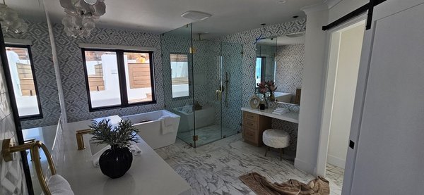 Bathroom Remodel in 2023 - Remodeled a bathroom to create a modern, serene space. Installed a sleek walk-in shower with frameless glass doors and polished gold accents Bathroom Remodel in 2023 - Remodeled a bathroom to create a modern, serene space. Installed a sleek walk-in shower with frameless glass doors and polished gold accents