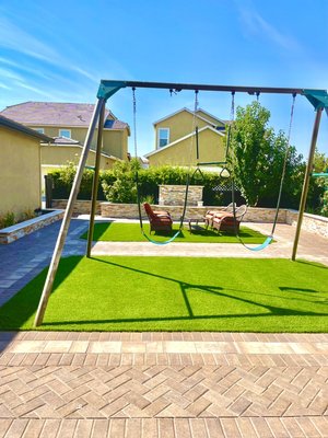 Backyard - Paver stone, retaining wall, synthetic turf. Backyard - Paver stone, retaining wall, synthetic turf.