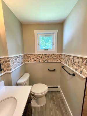 1950s Bathroom Remodel - This once outdated and dark bathroom was transformed into a modern space with custom features.  Call us otday and let us help bring your modern vision to life!