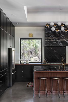 Dramatic Black in a Designer Project Kitchen and Bath - Dramatic black (Sherwin Williams "Tricorn Black") was used to full effect in this fabulous designer project, with painted kitchen and bath cabinets in a satin lacquer.  Design by Blueberry Jones Design.