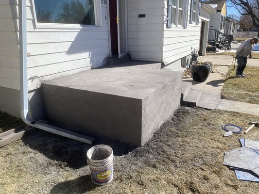 Stamped Concrete Patio - This customer asked us to come out and replace her 65+ yr patio that was sinking and crumbling. She wanted to do stamped concrete and this was the finished product. I wish I had a picture of what the patio looked like before. We sealed it off at the very end and set her up with our landscape guy who came out and put railing on for her! Very happy with these results! Stamped Concrete Patio - This customer asked us to come out and replace her 65+ yr patio that was sinking and crumbling. She wanted to do stamped concrete and this was the finished product. I wish I had a picture of what the patio looked like before. We sealed it off at the very end and set her up with our landscape guy who came out and put railing on for her! Very happy with these results!