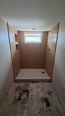Complete Transformation: Walk-In Shower & Wood-Look Tile - Walk-In Shower & Whole-Home Wood-Look Tile
This project began with the removal of old tile in the walk-in shower, followed by the installation of brand-new tile to create a fresh, modern, and durable shower space. After completing the bathroom renovation, we continued throughout the rest of the home with the installation of wood-look tile flooring, combining the natural warmth of hardwood with the strength and easy maintenance of tile. The result is a cohesive, stylish finish that enhances both the functionality and aesthetic appeal of the entire home. Complete Transformation: Walk-In Shower & Wood-Look Tile - Walk-In Shower & Whole-Home Wood-Look Tile
This project began with the removal of old tile in the walk-in shower, followed by the installation of brand-new tile to create a fresh, modern, and durable shower space. After completing the bathroom renovation, we continued throughout the rest of the home with the installation of wood-look tile flooring, combining the natural warmth of hardwood with the strength and easy maintenance of tile. The result is a cohesive, stylish finish that enhances both the functionality and aesthetic appeal of the entire home.